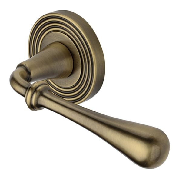 RR7156-AT  Antique Brass  Heritage Brass Roma Reeded Lever Furniture on Round Rose