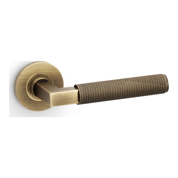 AW200AB • Antique Brass • Alexander & Wilks Hurricane Knurled Levers on Round Roses