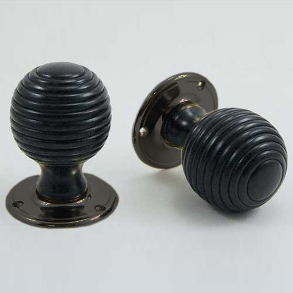 DKF081MXC-IBM  Ebony / Bronze  Timber Beehive Knobs On Round Roses