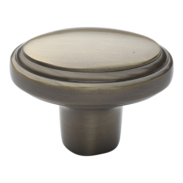 C3975-AT  40 x 25 x 16 x 30mm  Antique Brass  Heritage Brass Oval Stepped Cabinet Knob