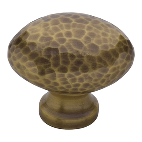 HAM114-32-AT � 32 x 15 x 28mm � Antique Brass � Heritage Brass Oval Hammered Cabinet Knob