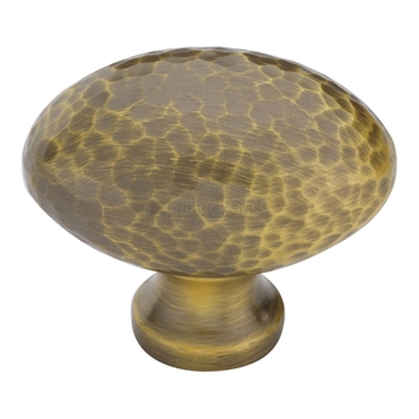 HAM114-38-AT � 38 x 15 x 32mm � Antique Brass � Heritage Brass Oval Hammered Cabinet Knob