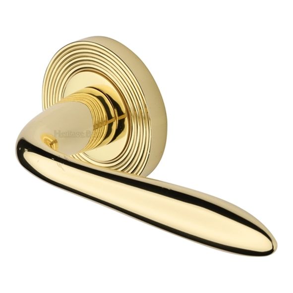 RR1752-PB • Polished Brass • Heritage Brass Sutton Reeded Lever Furniture on Round Rose
