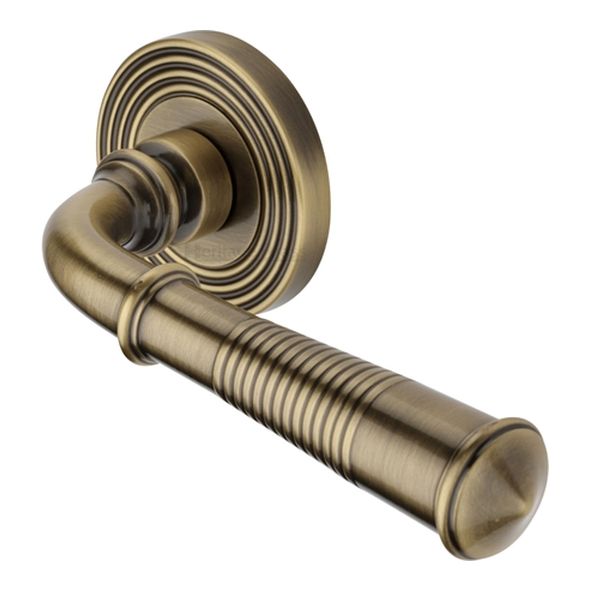 RR1935-AT • Antique Brass • Heritage Brass Bridgetown Reeded Lever Furniture on Round Rose