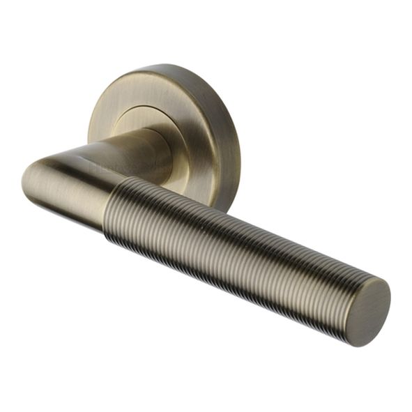 V2274-AT • Antique Brass • Heritage Brass Bauhaus Mitre Knurled Lever Furniture on Round Rose