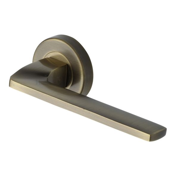 V3790-AT • Antique Brass • Heritage Brass Metro Angled Lever Furniture on Round Rose