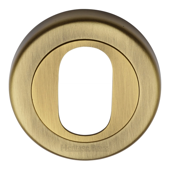 V4010-AT • Antique Brass • Heritage Brass Plain Round Oval Cylinder Escutcheon