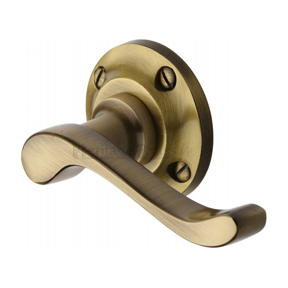 V820-AT • Antique Brass • Heritage Brass Bedford Levers On Traditional Round Roses